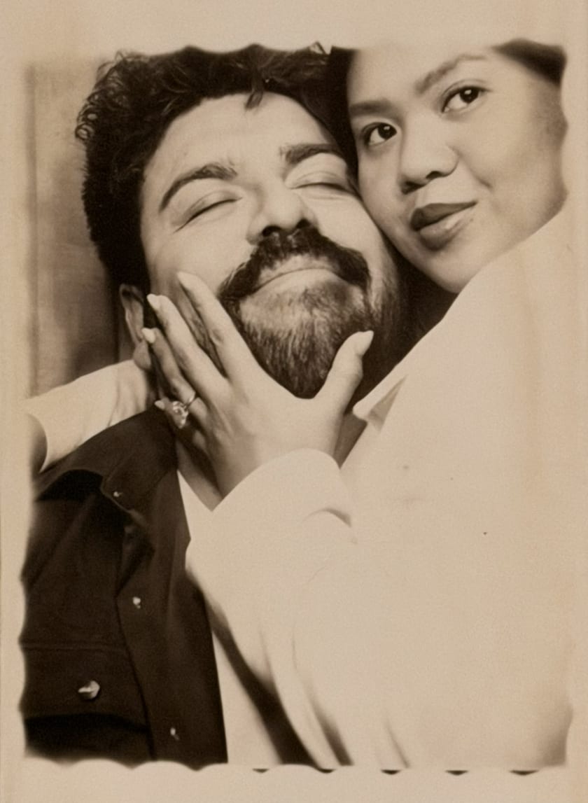 Sepia photobooth portrait of Ann and Chris kissing