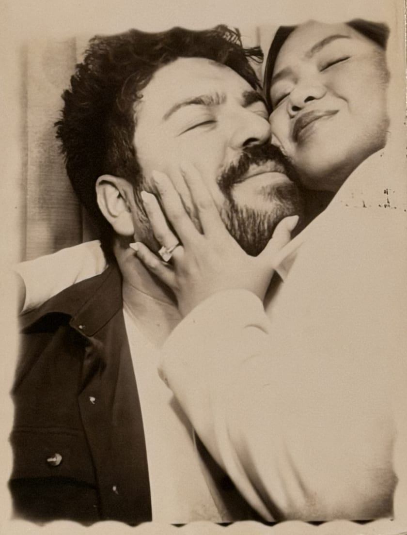Sepia photobooth portrait of Ann and Chris grinning