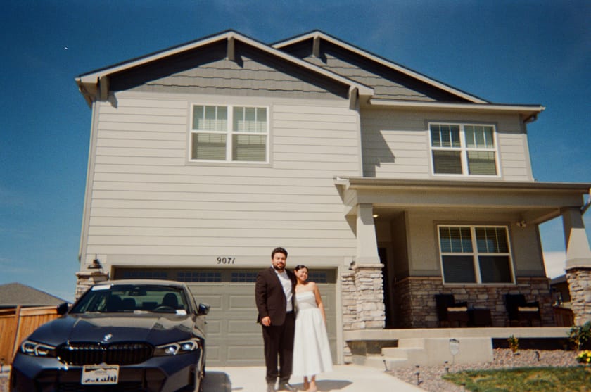 Film photo: an embrace in the driveway of their first home