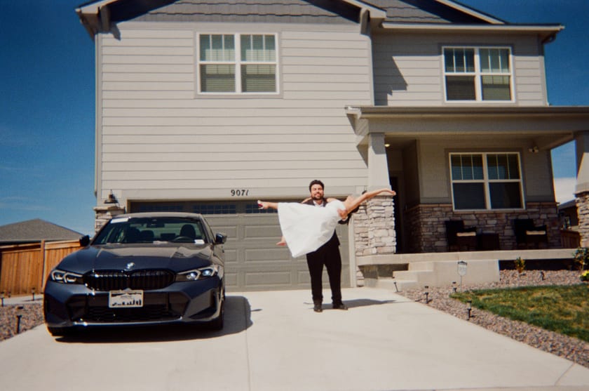 Film photo: Chris celebrates in the driveway, jacket flying