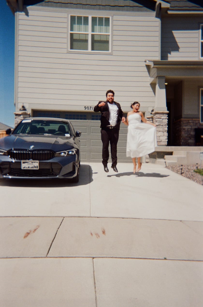 Film photo: walking toward the camera outside their home