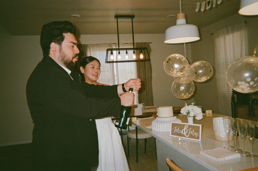 Film photo: easing the cork out — the big pop moment