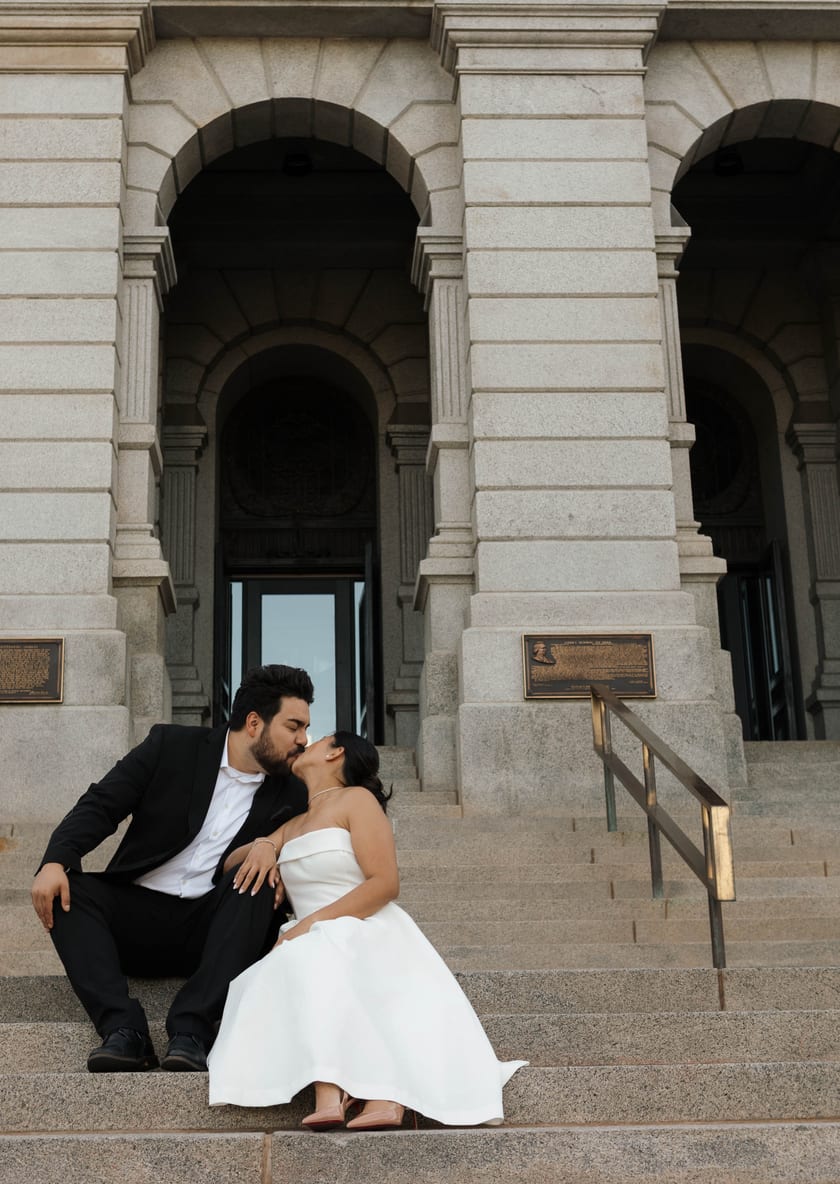 Sitting close on the granite steps, sharing a quiet moment