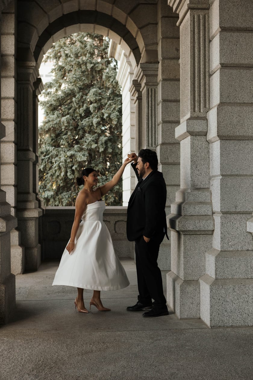 A gentle touch to the forehead while dancing under the arches