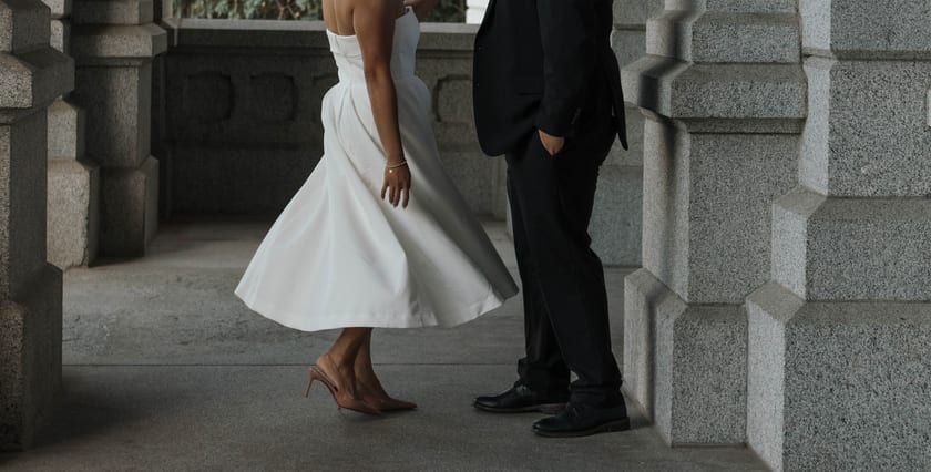 The hem of the dress mid-twirl against the stone floor