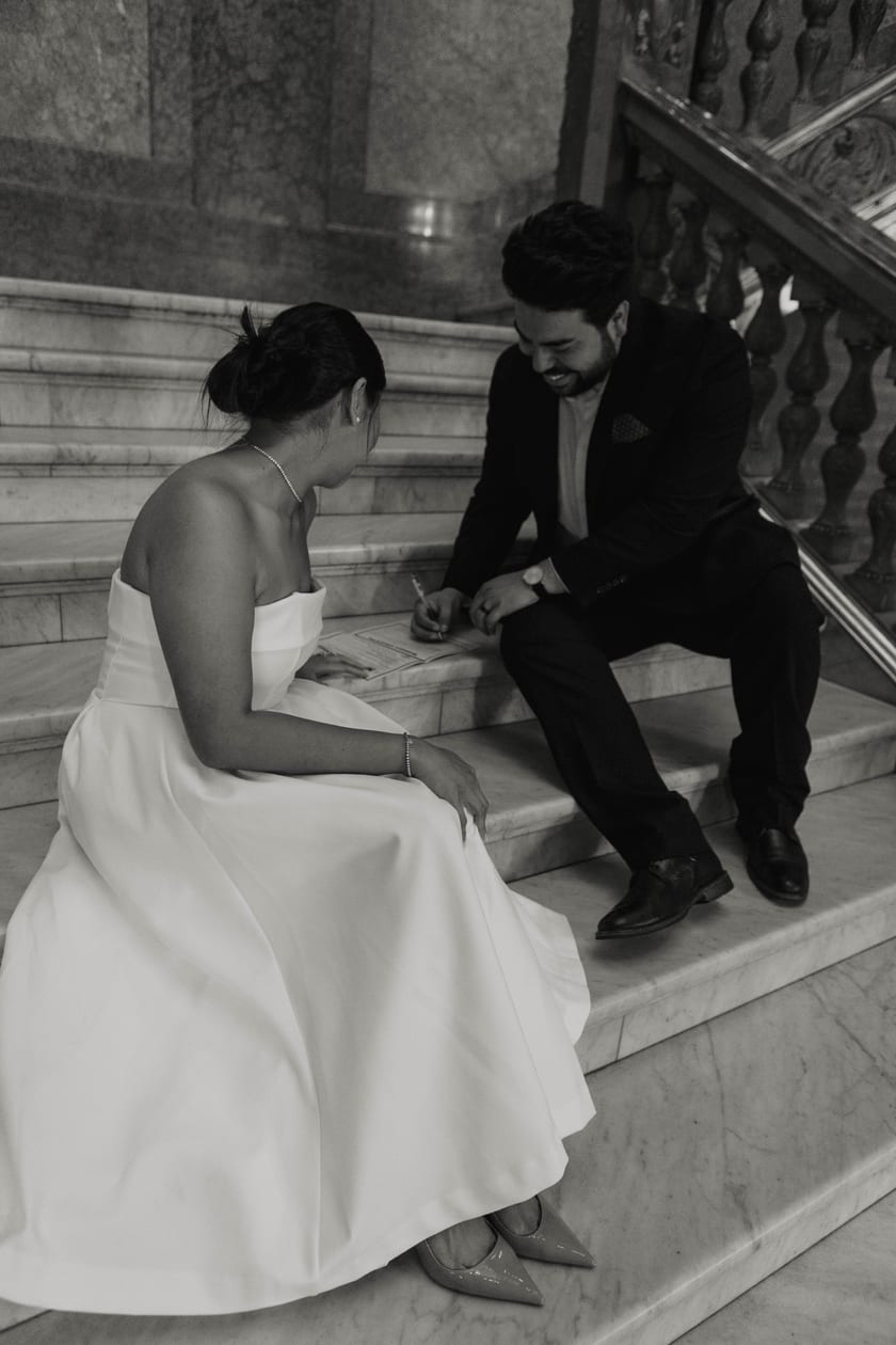 Sitting together on the marble staircase, catching their breath