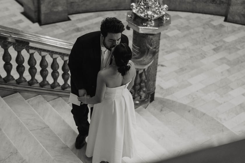 Black-and-white: a kiss on the marble staircase